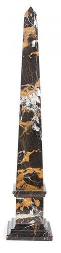 A Variegated Black Marble Obelisk Height 28 inches.
