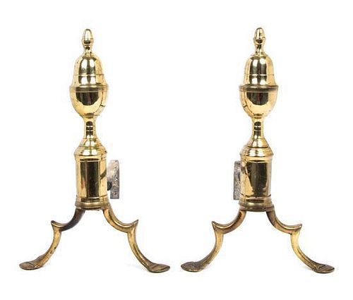 A Pair of Brass Andirons Height 14 1/2 inches.