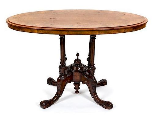 A Victorian Inlaid Walnut Center Table Height 25 1/2 x width 41 x depth 24 inches.