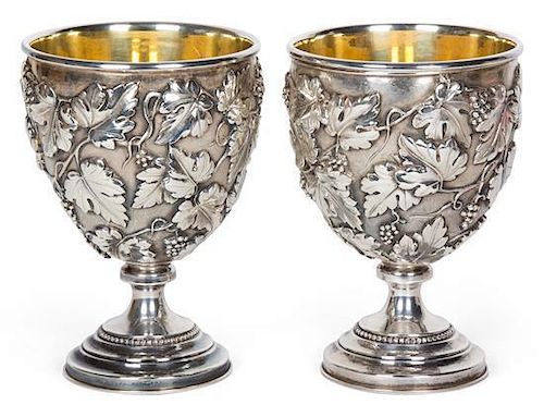 A Pair of Silver Repousse Goblets, , having grapevine decorated bowl with gilt wash interior, on trumpet form base.