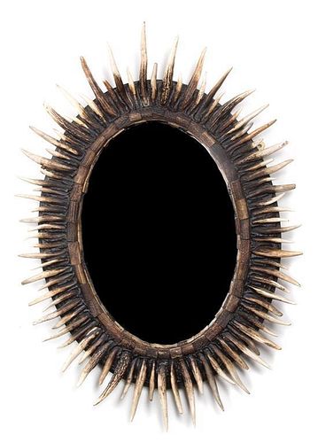 An Anthony Redmile Horn-Applied Oval Mirror 34 x 28 inches.