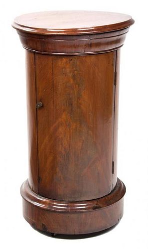 A Continental Mahogany Pedestal Cabinet Height 28 1/4 x diameter 14 1/2 inches.