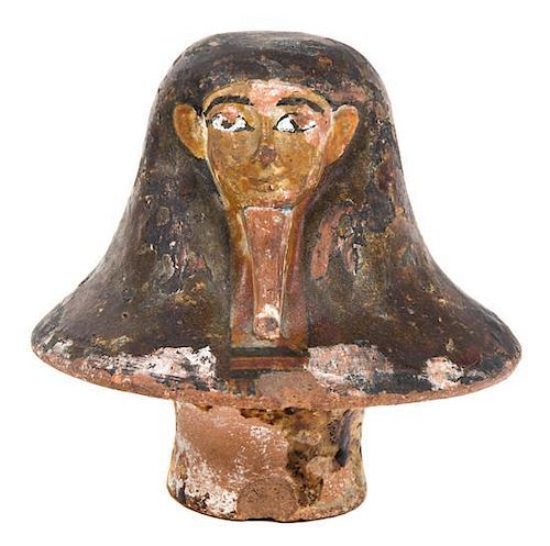 An Egyptian Terra Cotta Canopic Jar Lid Height 4 inches.