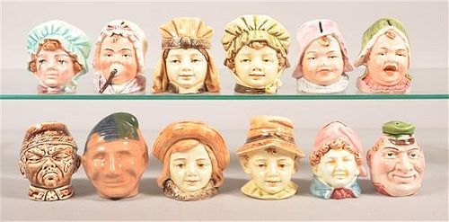 Twelve Ceramic Figural Bust Still Banks.
