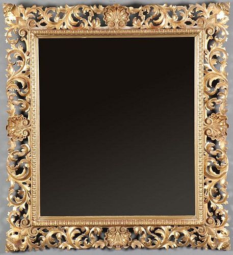 A GOOD FLORENTINE CARVED AND GILT WOOD MIRROR
