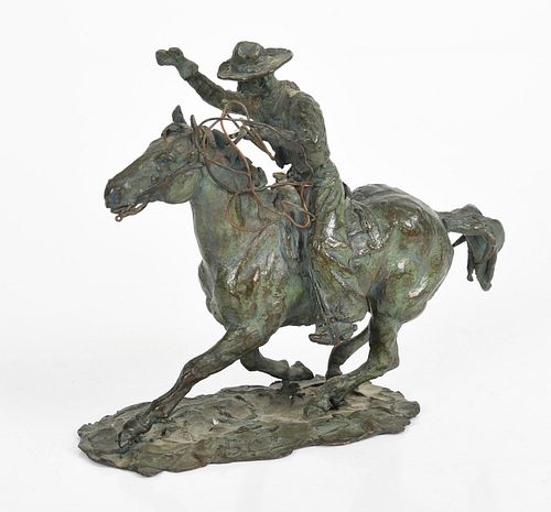 A Bronze Cowboy and Horse Sculpture