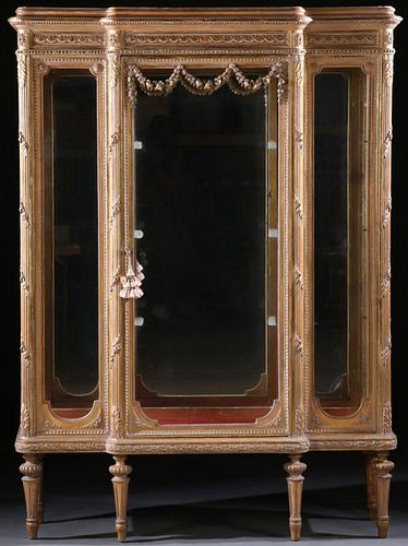 A FINE LOUIS XV STYLE CARVED AND GILT WOOD VITRIN