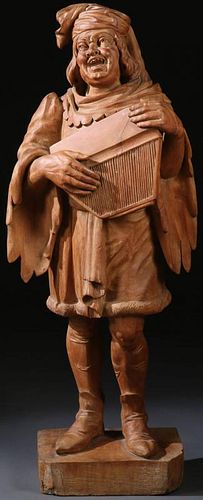 A CARVED WOOD FIGURE OF A STREET MUSICIAN