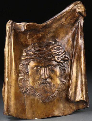 A CARVED AND GILT WOOD PLAQUE OF THE VEIL