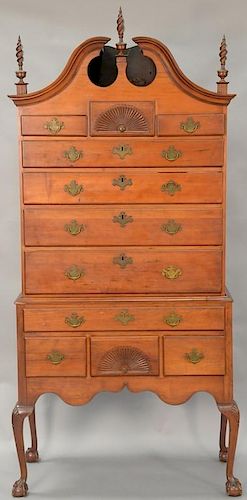 Chippendale cherry high chest in two parts, upper section with full bonnet top on lower section with carved skirt set on cabr