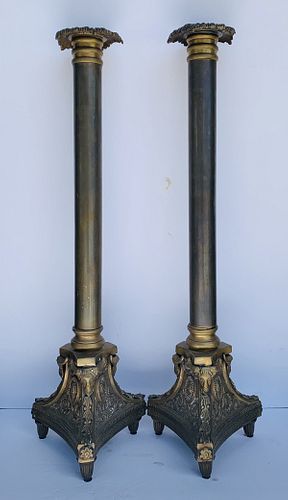 Pair of tall candle holders in bronxe Signed A.K.