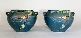 A pair of Roseville pottery Apple Blossom blue cachepots.