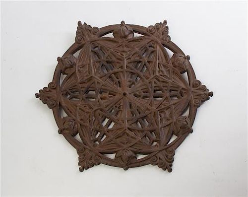 A Cast Iron Elevator Grill Medallion, after the Louis Sullivan example for the Guaranty Building, Diameter 11 1/4 inches.