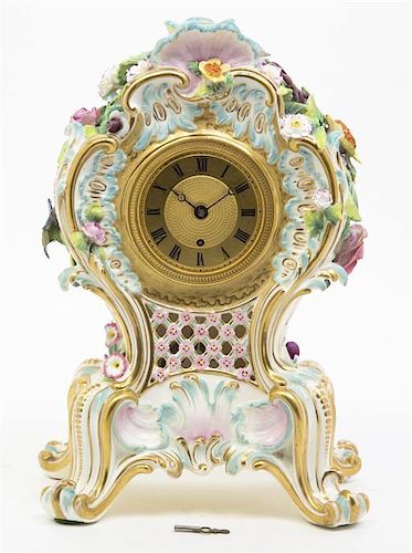 A Continental Porcelain Mantel Clock, Height 12 inches.
