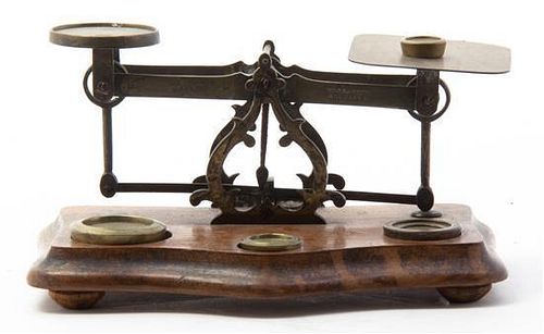 * A Brass and Walnut Postage Scale, Width 8 1/4 inches.