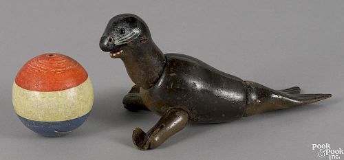 Schoenhut painted wood seal with glass eyes and a ball, 8 1/2'' l.