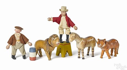 Schoenhut circus group, reduced size, to include a lion, a tiger, a zebra, a ringmaster, 7'' h.