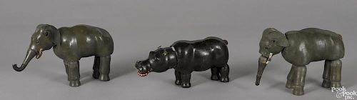 Two Schoenhut painted wood elephants with glass eyes, 9 1/2'' h., together with a hippopotamus