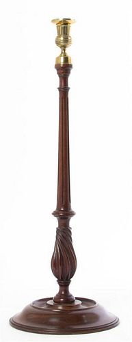 * A Regency Mahogany and Brass Candlestick, Height 21 1/2 inches.