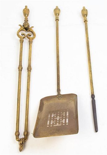 * A Set of English Brass Fireplace Tools, Length of longest 27 inches.