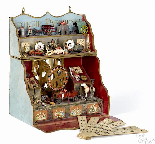 French Loterie Parisienne parlor toy with a gaming wheel and a large group of prizes