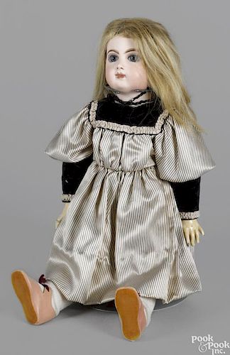 E. 8 J. Jumeau doll with a bisque socket head, blue glass stationary eyes, a closed mouth