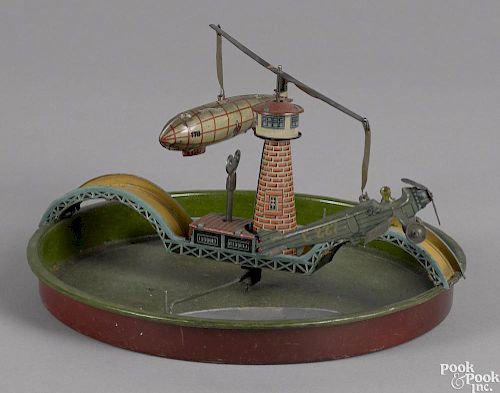 George Kellerman tin lithograph wind-up boat, airplane, and zeppelin toy, 8 1/2'' dia.