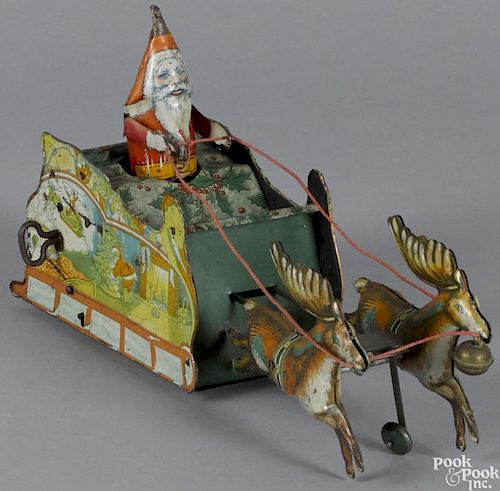 Strauss tin lithograph clockwork Santee Claus toy with reindeer, 11'' l.