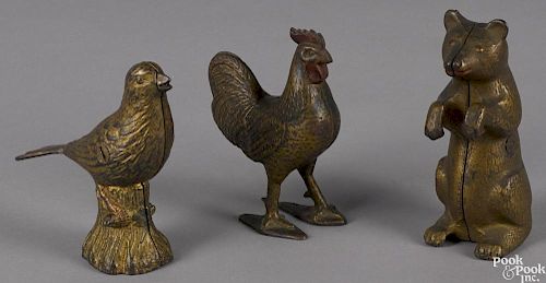 Three painted cast iron still banks, to include a begging bear, 5 3/8'' h., a rooster, 5'' h.