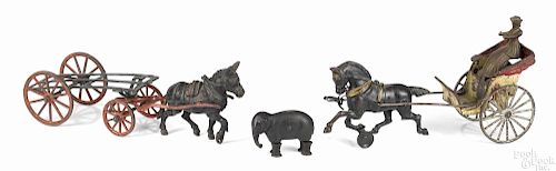 Three American cast iron toys, to include an Ives walking elephant, 3 1/2'' l., a horse drawn sulky