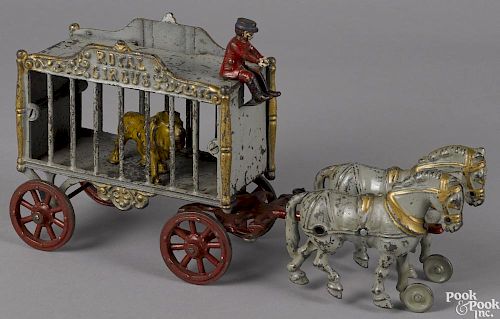 Hubley cast iron horse drawn Royal Circus cage wagon with a lion and a driver, 15 3/4'' l.