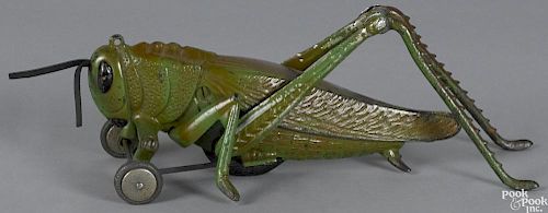 Hubley cast iron and aluminum grasshopper pull toy with articulated legs and clicker, 11 1/2'' l.