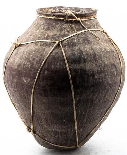 An Earthenware Storage Vessel, Height 20 inches.