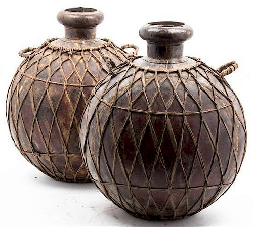 A Pair of African Copper Storage Vessels, Height 18 inches.