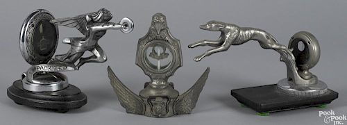 Three automobile mascot hood ornaments, to include a Boyce Motometers on a winged base