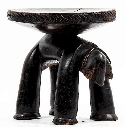 An African Carved Wood Stool, Height 9 1/2 inches.