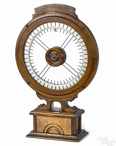 Oak coin operated gambling wheel, patented May 7, 1895, 21 1/2'' h.