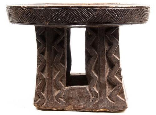 An African Carved Hardwood Stool, Width 18 1/2 inches.