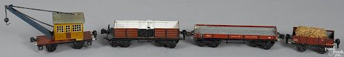 Four Marklin O Gauge freight train cars, painted and lithographed group, to include a derrick car