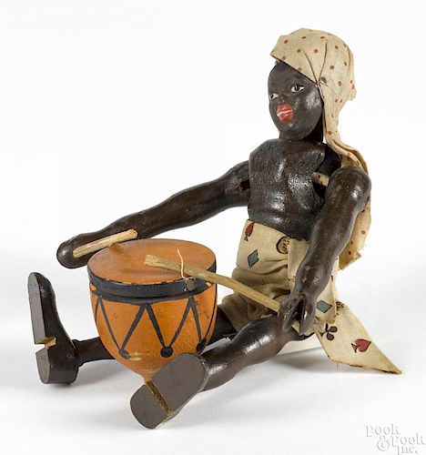 Schoenhut painted wood African drummer with a two-part head, the original drum, and drumsticks