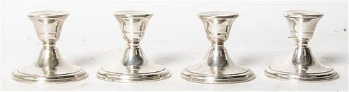 A Set of Four American Silver Small Candlesticks, 20th Century, weighted, each with a circular foot