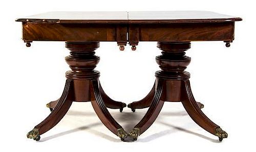 An American Mahogany Double-Pedestal Dining Table, Height 31 1/2 x width 50 x depth 51 inches.