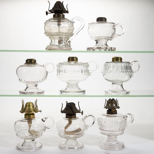 ASSORTED PATTERN KEROSENE FOOTED FINGER LAMPS, LOT OF EIGHT