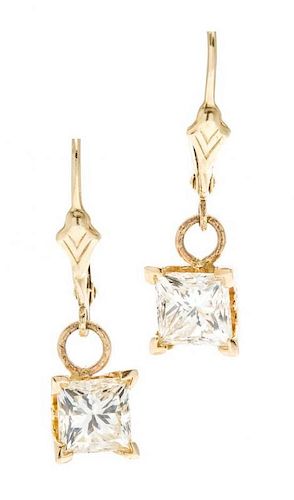 A Pair of 14 Karat Yellow Gold and Diamond Earrings, 1.50 dwts.