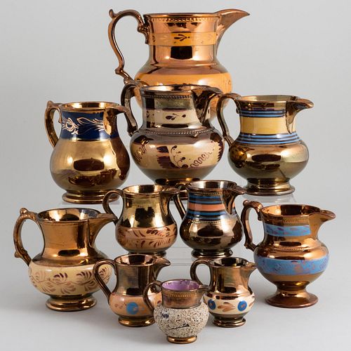 Group of Eleven English Lusterware Pitchers in Various Sizes