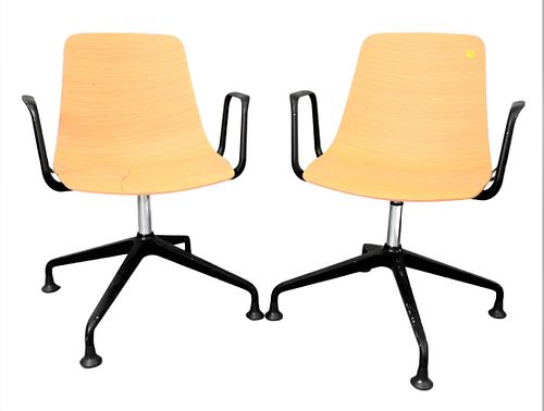A Pair of Dietiker Swivel Chairs