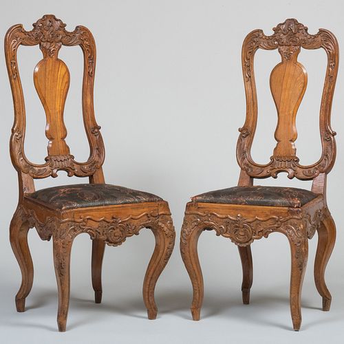 Pair of Dutch Rococo Style Carved Oak Side Chairs with Painted and Embossed Leather Seats