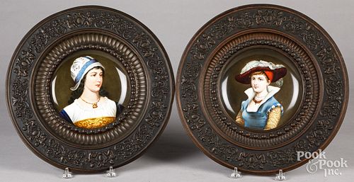 Pair of painted porcelain portrait plates