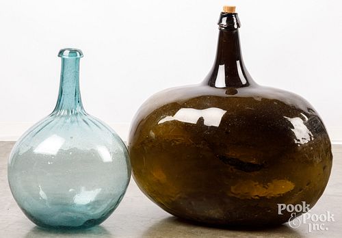 Two large blown glass bottles