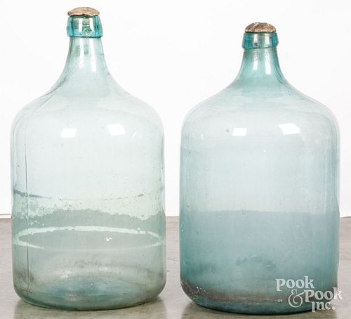 Pair of large aqua glass bottles